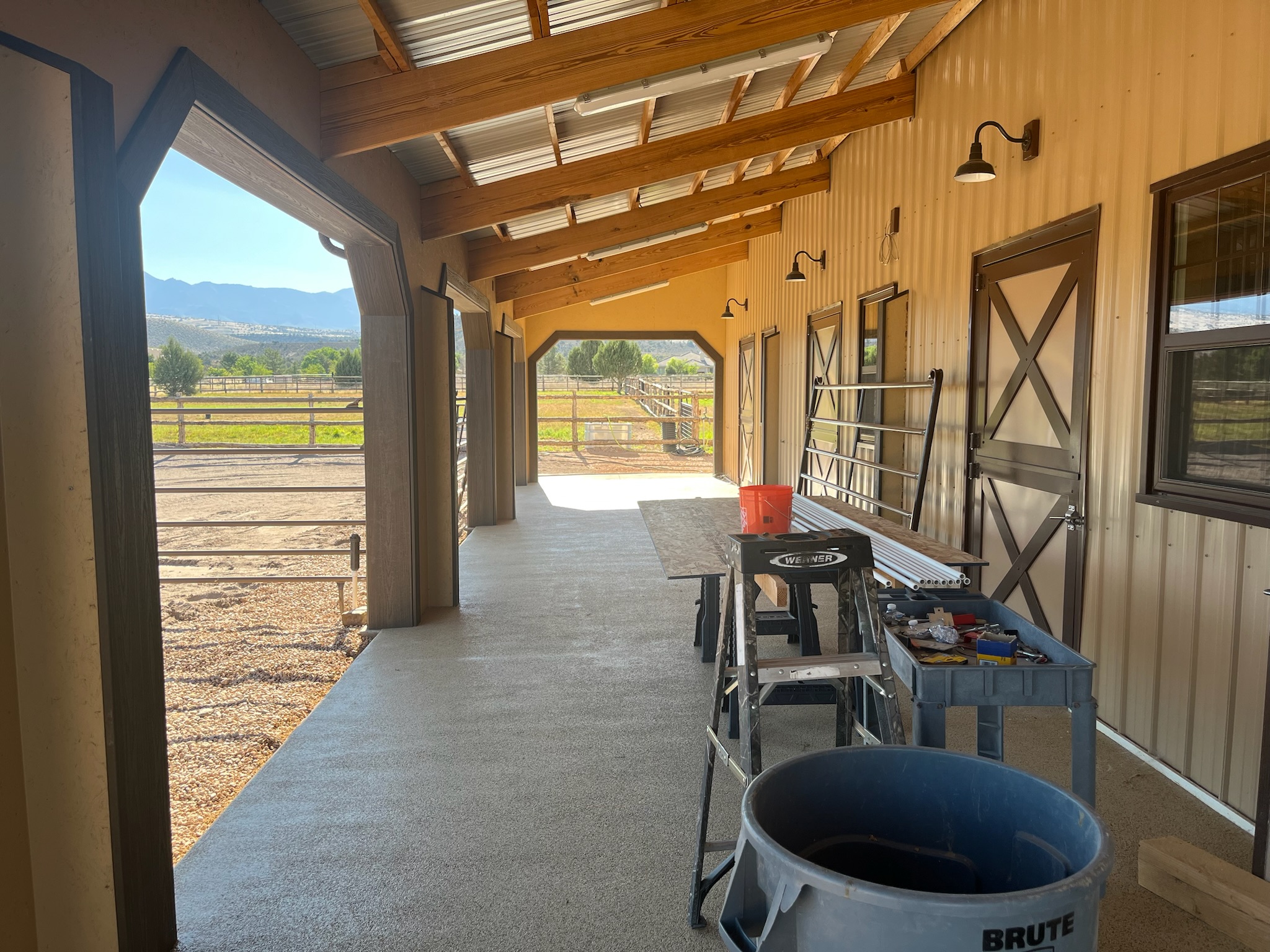 Flake-coated covered porch on a barn with mountains behind in Gilbert, AZ